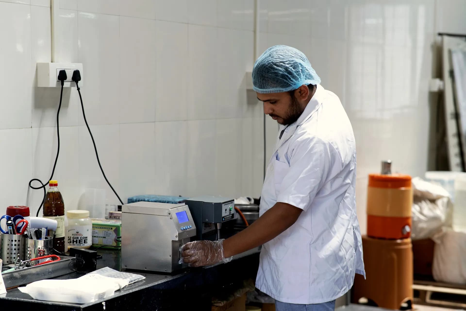 A PureDairy team member testing milk in our in-house lab